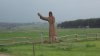 026-01 Pilgrim Statue points the Way to Santiago outside of Sauges.JPG