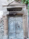 036-34 Doorway in Conques dated 1771 with scallop shell.webp