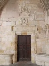 056-06 Medieval door with scallop shell at Condom cathedral.webp