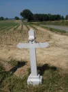 063-07 Pilgrims have left offerings on a roadside cross before Vignes.webp