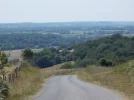 063-31 Steep hill into Larreule. Church in distance is at Uzan..webp