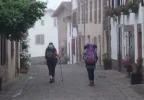 069-02 Pilgrims heading out to cross the Pyrenees mountains early on a misty morning.webp