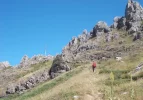 094-33 Angel climbs to the Cross of San Salvador at the summit of the El Canto de la Tusa.webp