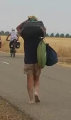 guy carrying suitcase.webp