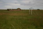 1210-football field and cemetery entering El Ganso (Astorga-Rabanal del Camino, 11.06.2011).webp