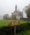 Primitivo church with bar sign – cropped.webp