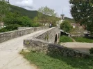 Bar (just out of sight) next to the river and old bridge in Sosauren.webp