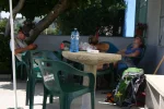 1712-pilgrims resting in front of bar in Santa Marina (Vilaserio-Olveiroa, 26.06.2011).webp