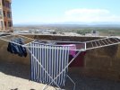 31 Aug #14 1428hrs Viana Our washing on the terrace, city walls behind, outside Albergue Andre...JPG