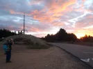 21 Sep #9 0812hrs Beautiful cloud colours above Cruz de Ferro. Pat taking photo with IPad.JPG