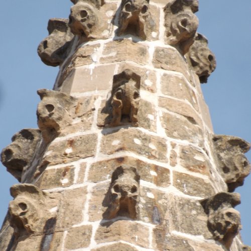 Tower of spooky heads taken from cloister Santa Maria Pamplona