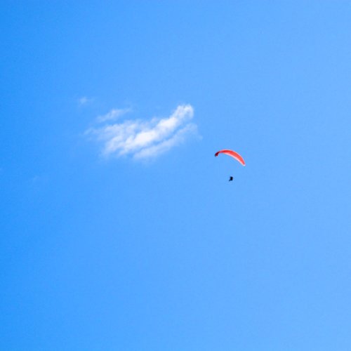 Paraglider being chased by a cloud